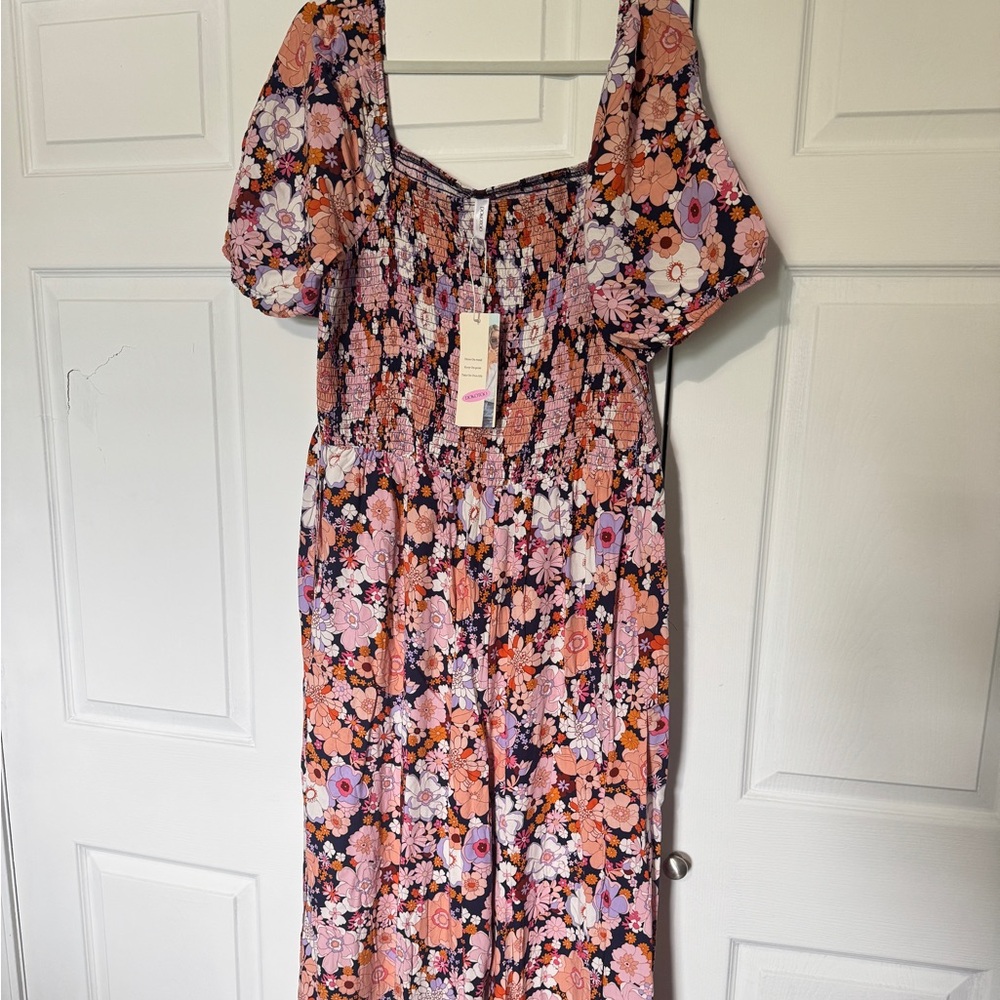 New with tags. Never worn. Dokotoo one piece jump suit. Size 2 XL